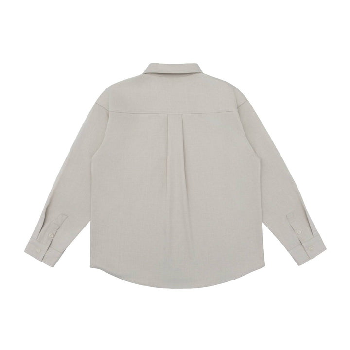Unisex Oversize Shirt Jacket in a minimalist workwear style with rounded hem and chest flap pocket Mune Fashion