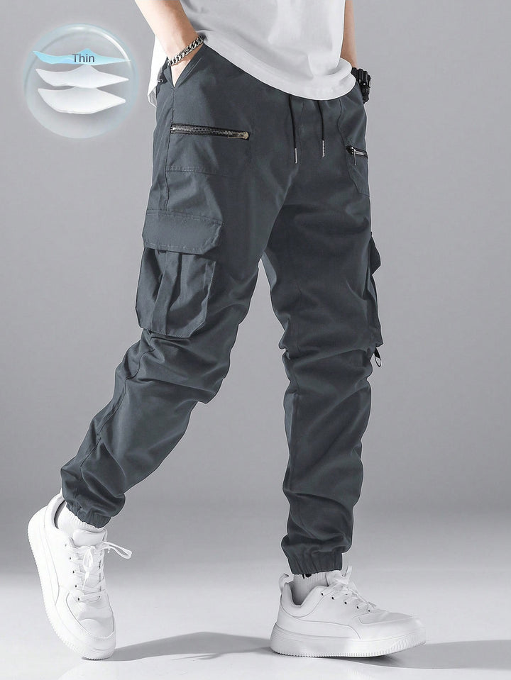Men's slim cargo joggers with multiple zippered pockets, elastic ankle cuff, and drawstring Mune Fashion
