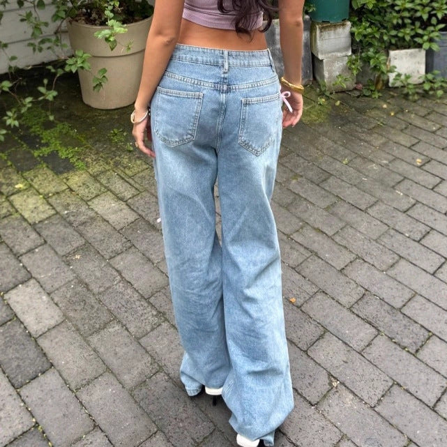 Women High-Waist Baggy Jeans with Vintage Wash, Rips and Pink Bow Applications Mune Fashion