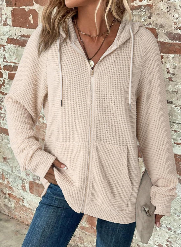 Women's waffle knit hooded jacket with zipper, kangaroo pockets, and relaxed silhouette Mune Fashion