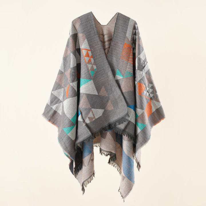 Women's oversized ruana in jacquard wrap style with triangular pattern and fringe hem Mune Fashion
