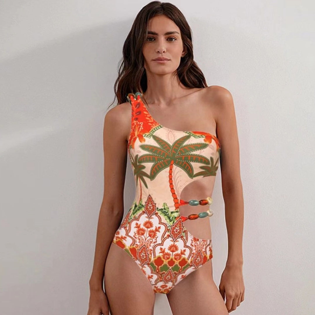 Ladies one-piece swimsuit with fashionable cut-out and matching beach skirt Mune Fashion