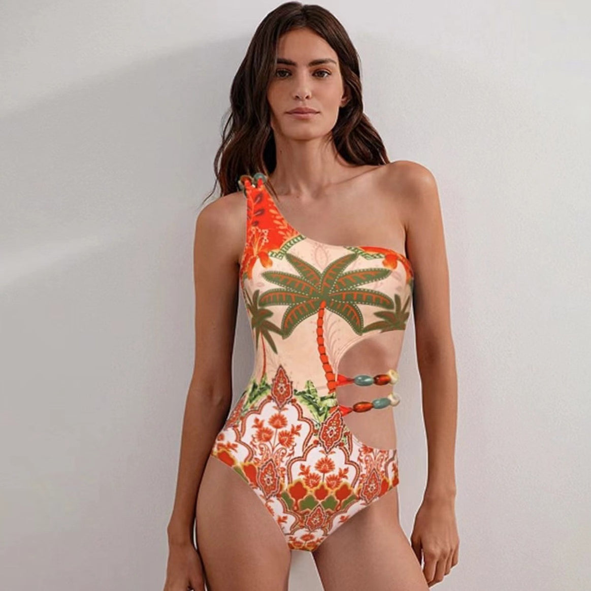 Ladies one-piece swimsuit with fashionable cut-out and matching beach skirt Mune Fashion