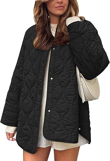 Women's quilted jacket in oversized design with curved quilting and side slit Mune Fashion
