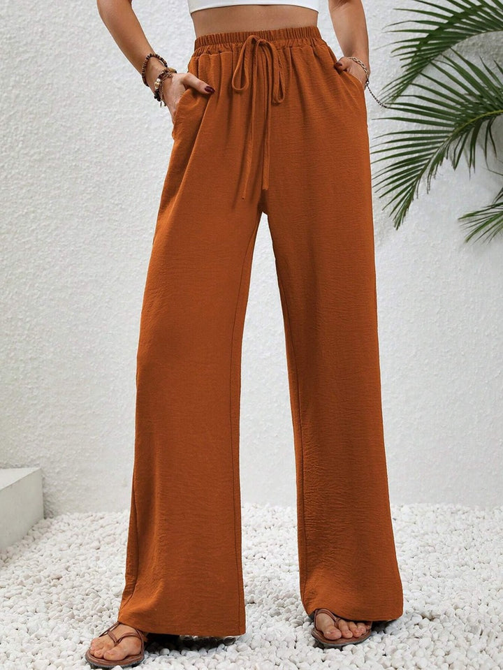 Ladies lightweight, loose-fitting beach pants with elastic waistband, drawstring and side pockets Mune Fashion
