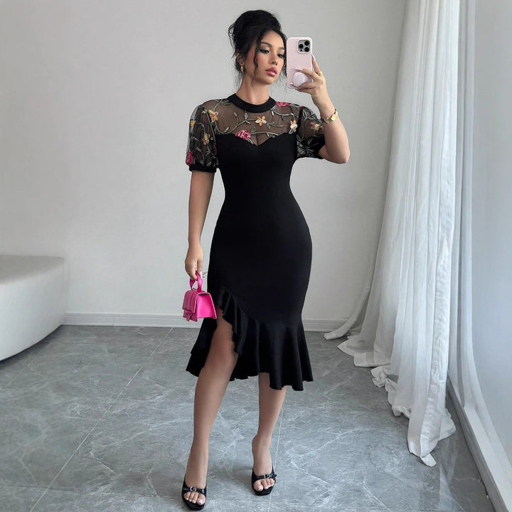 Women's figure-hugging midi dress with embroidered mesh top, puff sleeves, and asymmetrical ruffled hem Mune Fashion