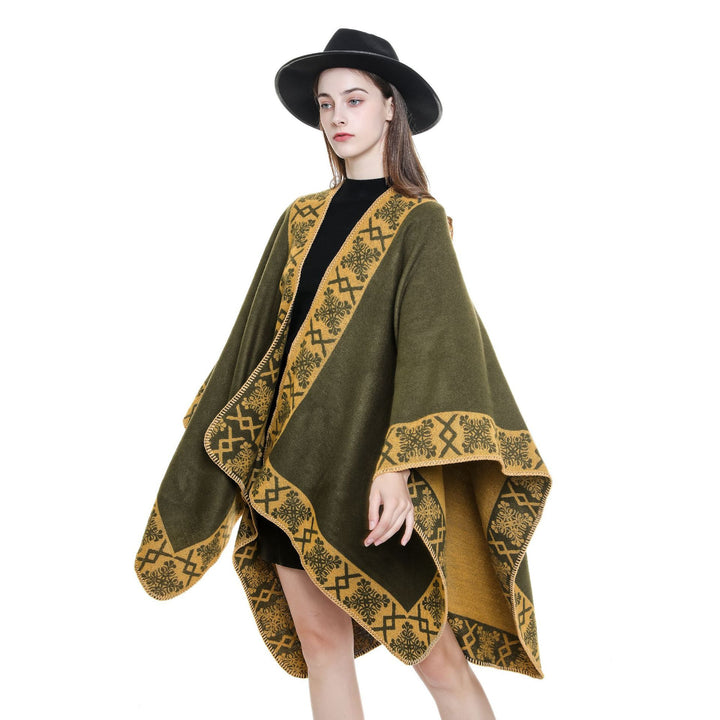Women's oversized poncho cape made of wool blend with woven border jacquard and decorative chain stitch