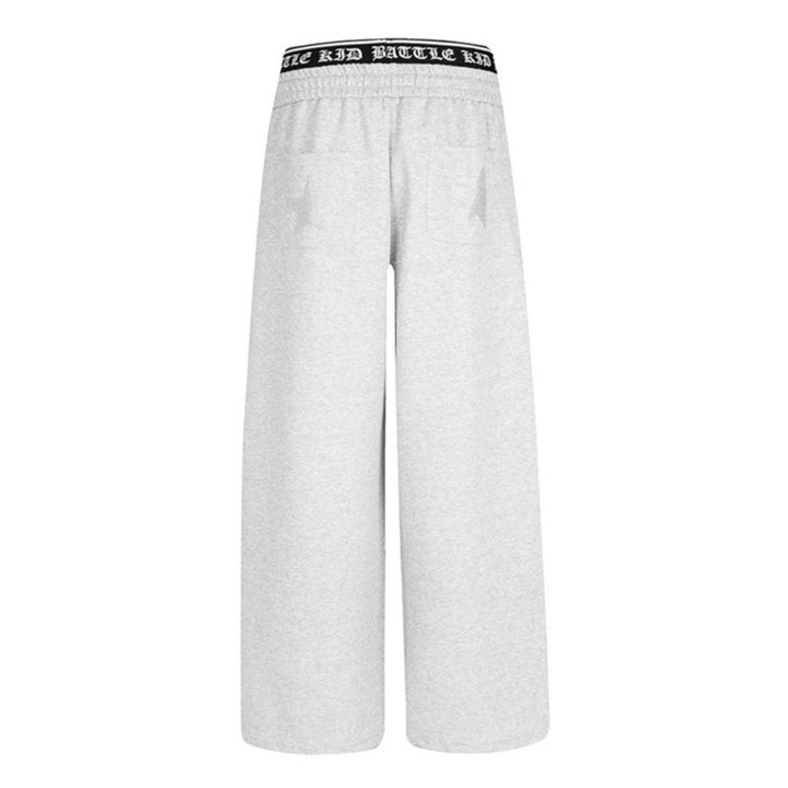 Women's wide lounge jogging pants with high logo waistband, gothic print and drawstring Mune Fashion