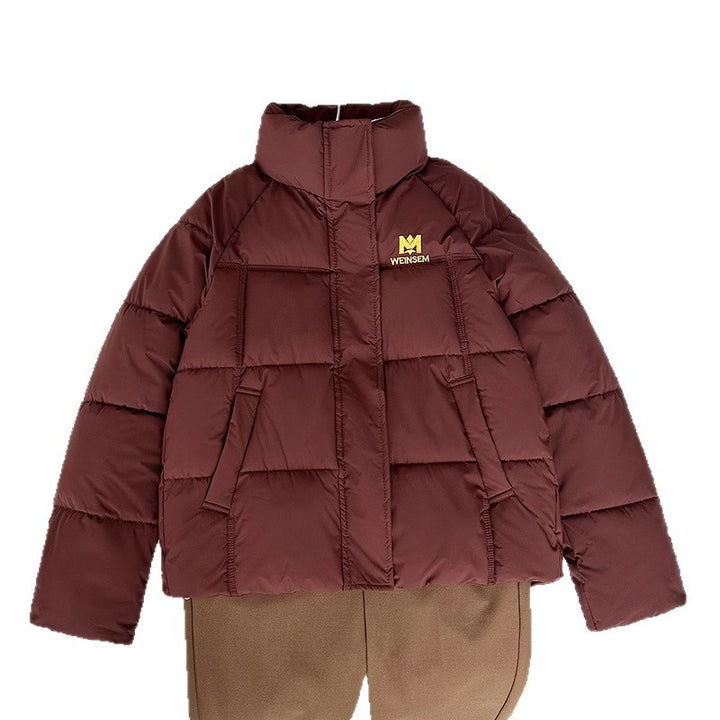 Women's nan compact short quilted jacket with high closing stand-up collar and diagonal pockets Mune Fashion