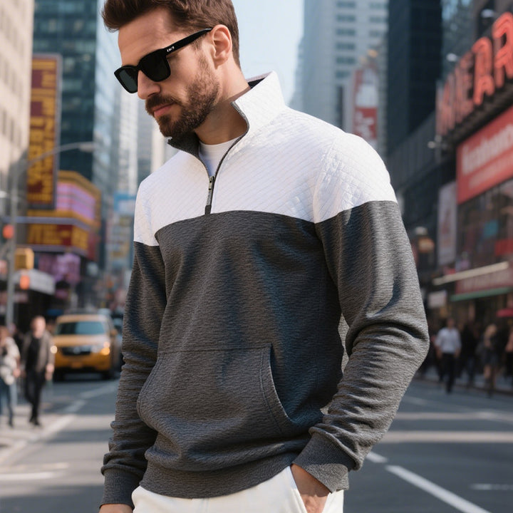 Men's color block half zip sweatshirt with quilted chest area, kangaroo pocket, and elastic cuffs Mune Fashion