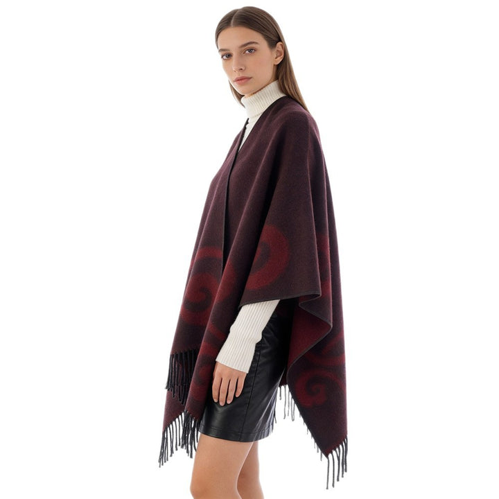Women's wool blend poncho with jacquard swirl pattern, V-neck and fringes
