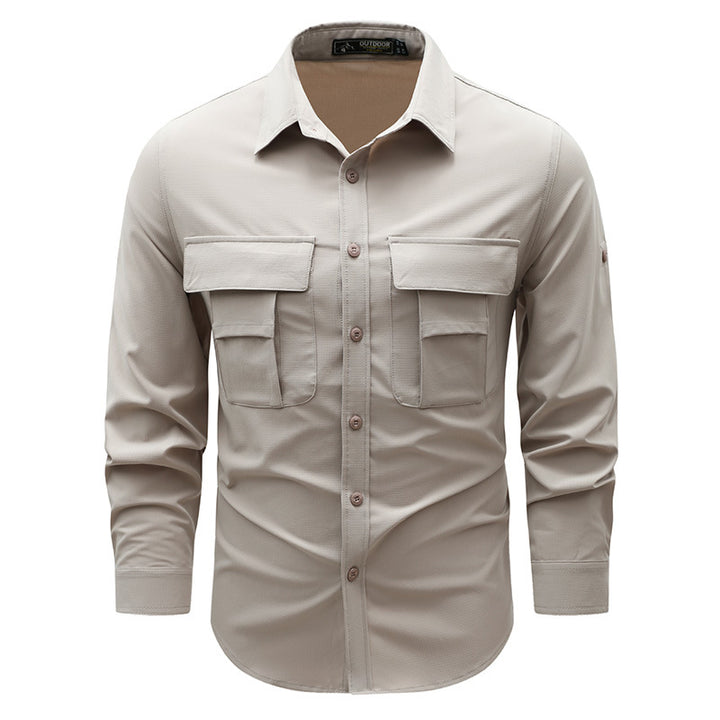 Men's lightweight travel utility shirt with double chest pockets, quick-drying ripstop fabric, and ergonomic cut.