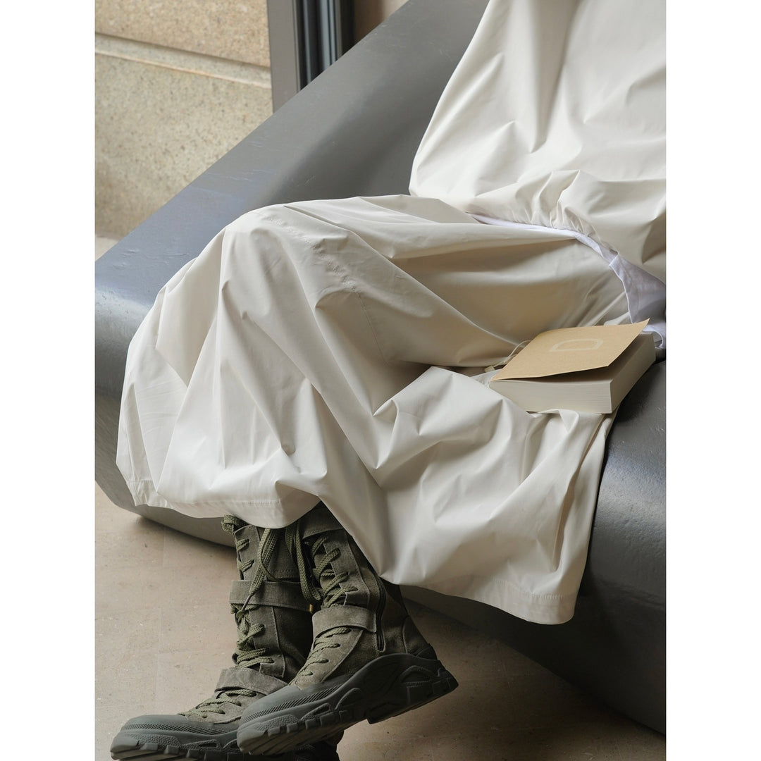 Women Longer Oversize Raincoat with concealed snap button placket and side pockets Mune Fashion
