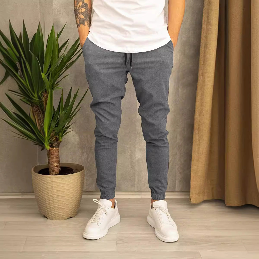 Men's slim fit jogging pants with elastic waistband, drawstring, and ribbed ankle cuff Mune Fashion