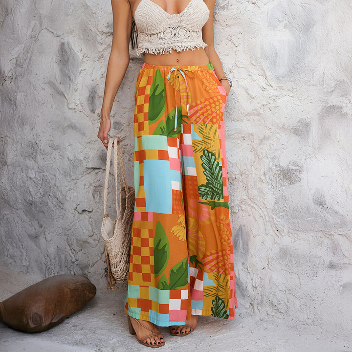Women wide Palazzo pants with drawstring waistband, side pockets and Mediterranean tile print Mune Fashion