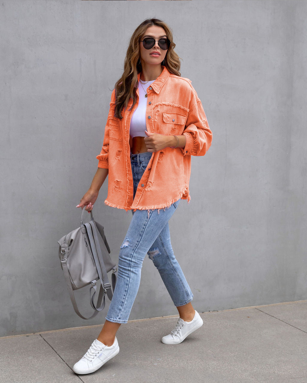 Women's oversized denim shirt jacket with frayed hem and distressed details Mune Fashion