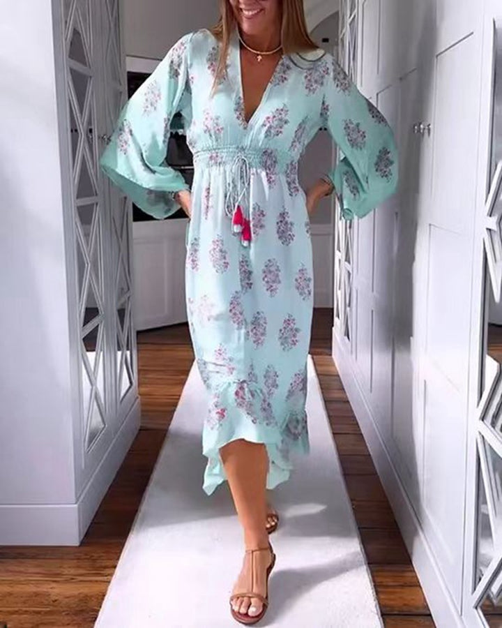 Women’s airy-flowing Boho midi dress with V-neck, gathered smock waist, drawstring with tassels, and asymmetrical ruffled hem Mune Fashion