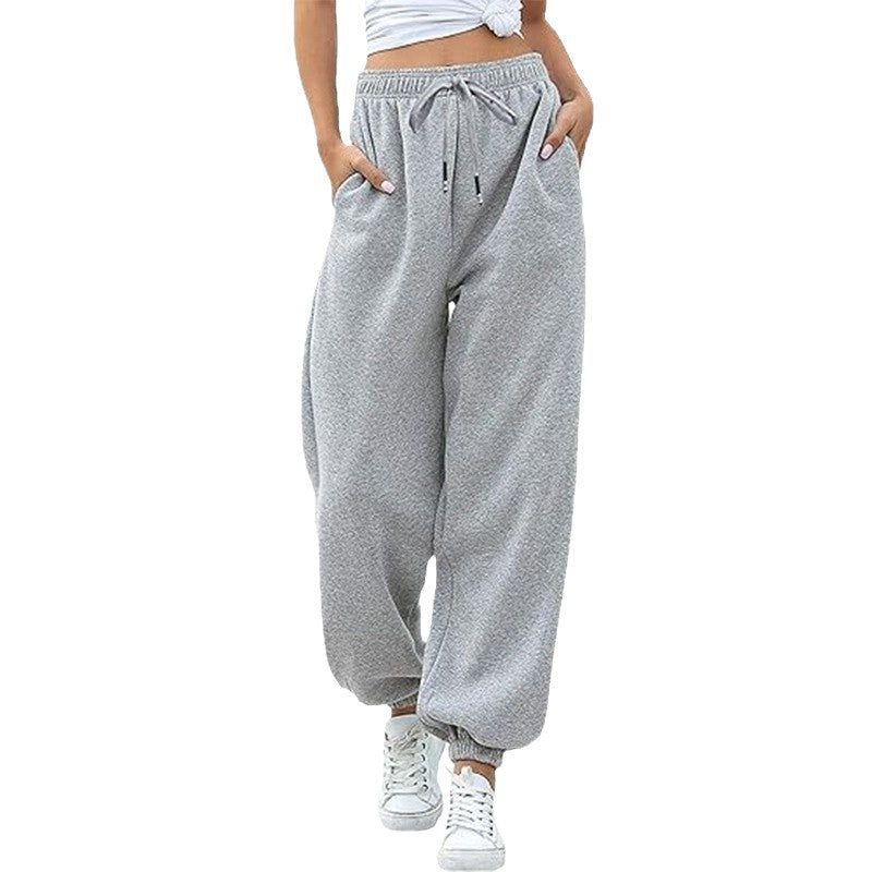 Women's wide High-Waist jogging pants made of soft fleece with elastic waistband, side pockets, and narrow cuffs Mune Fashion