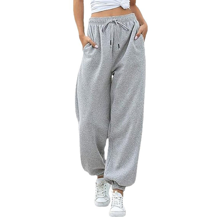 Women's wide High-Waist jogging pants made of soft fleece with elastic waistband, side pockets, and narrow cuffs Mune Fashion
