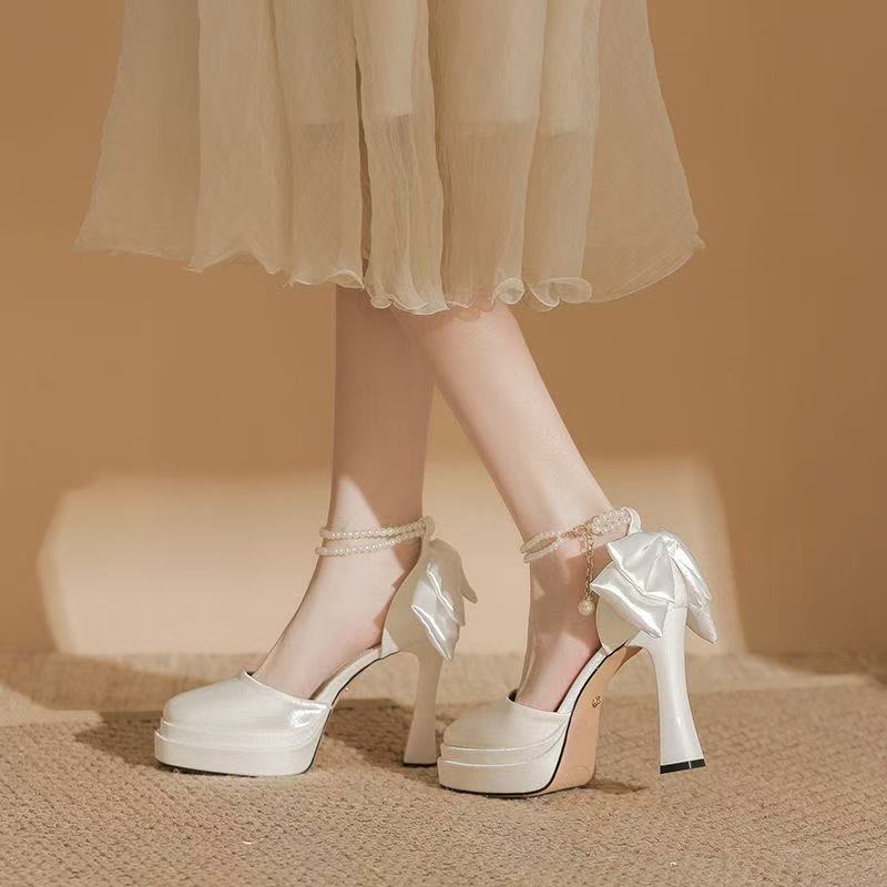 Ladies' satin platform pumps with decorative bow and adjustable ankle strap Mune Fashion