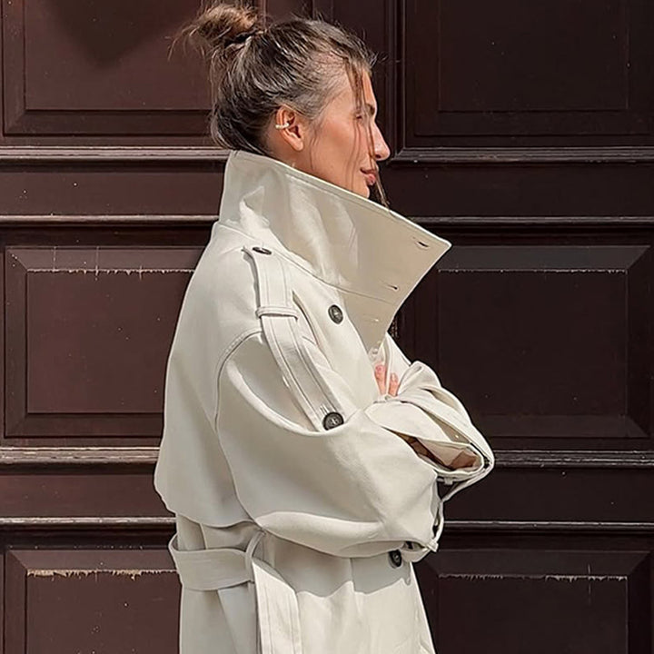Women's waistless long trench coat in oversized cut with double button placket and shoulder epaulettes Mune Fashion