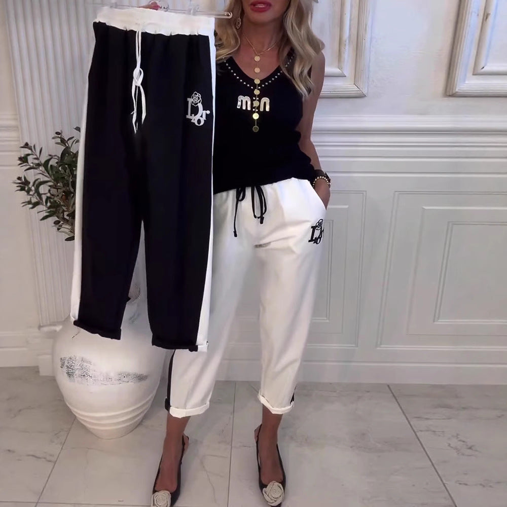 Women's cropped comfort joggers with side contrast stripes, elastic drawstring waist, and logo embroidery Mune Fashion