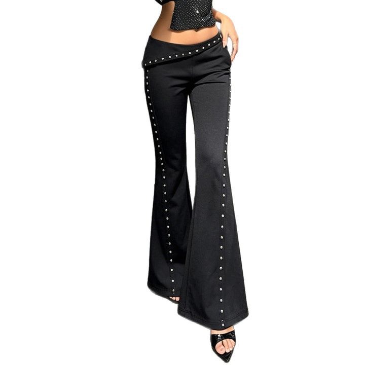Women's flared pants with asymmetrical folded waistband and metal studs along the side seam Mune Fashion