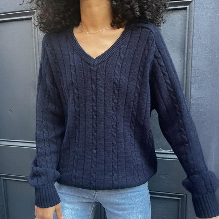 Women's fine textured knit sweater with V-neck, cable pattern and ribbed hem Mune Fashion