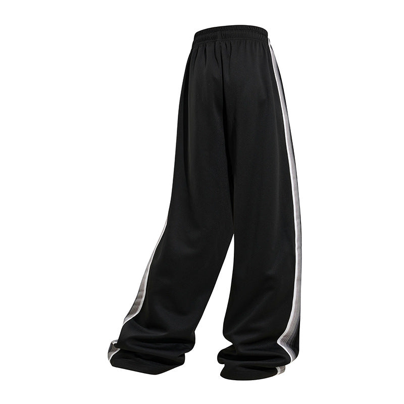 Men's loose baggy training pants with drawstring waistband, elastic comfort waistband, and side stripe detail Mune Fashion