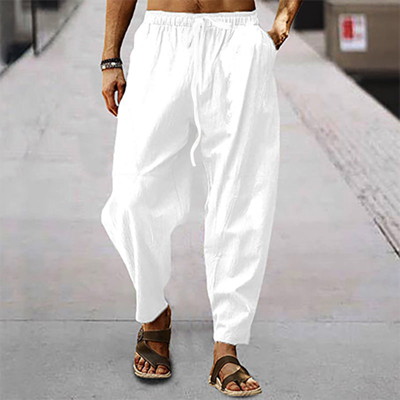 Men's loose linen casual pants with elastic tunnel drawstring waistband, low crotch, and tapered ankle length Mune Fashion