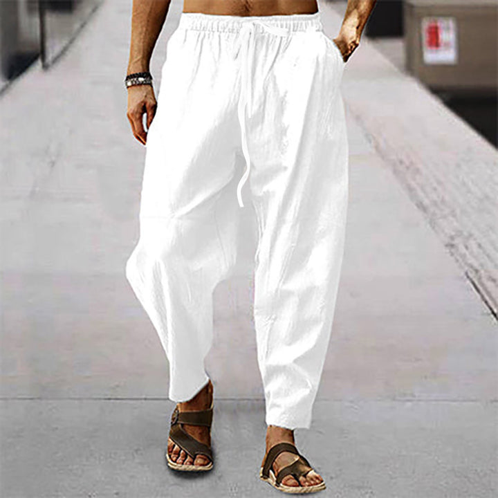 Men's loose linen casual pants with elastic tunnel drawstring waistband, low crotch, and tapered ankle length Mune Fashion