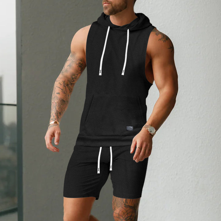Men's sleeveless hoodie vest set made of textured cotton blend with kangaroo pocket and drawstring shorts Mune Fashion