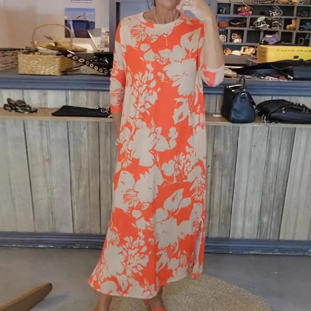 Women’s flowing A-line maxi dress with three-quarter sleeves round neckline side slit and inserted pockets Mune Fashion