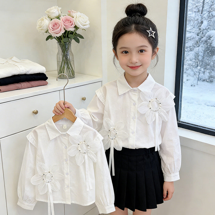 Girl's blouse with floral appliqués and elegant ruffle details Mune Fashion