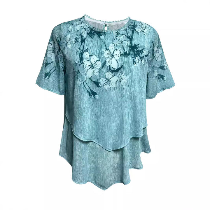 Women's two-layer blouse dress with asymmetrical tiered hem, floral print yoke, and wing sleeves Mune Fashion