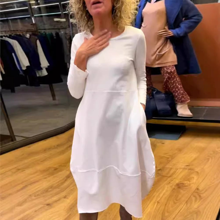 Women's asymmetrical balloon dress with three-quarter sleeves, side pockets, and flowing pointed hem Mune Fashion