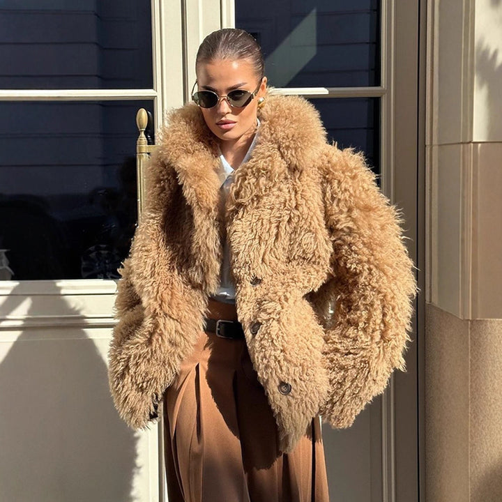 Women’s short coat made of voluminous bouclé faux fur with wrap and waist belt Mune Fashion