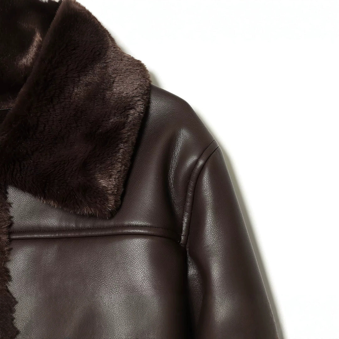 Women's short jacket in leather look with teddy lining, patch pockets and lapel collar Mune Fashion