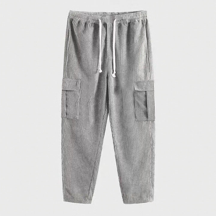 Men's corduroy cargo jogging pants with elastic drawstring waistband, flap pockets, and tapered leg Mune Fashion