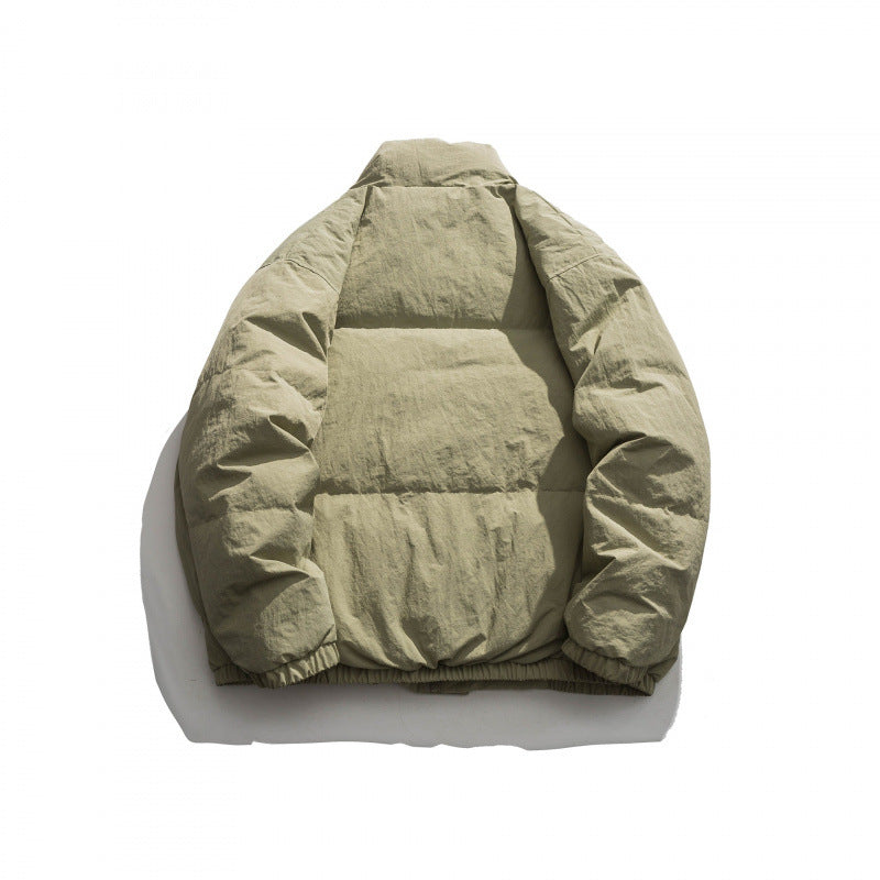 Unisex Oversized padded quilted jacket with high stand collar, large flap pockets and crinkle effect Mune Fashion
