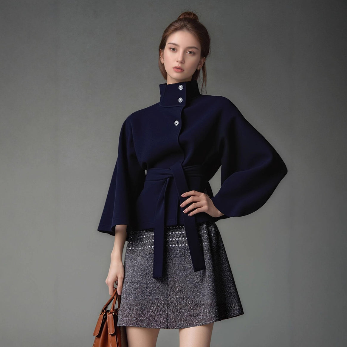 Women's short cape jacket with high stand-up collar, tie belt and boxy silhouette Mune Fashion