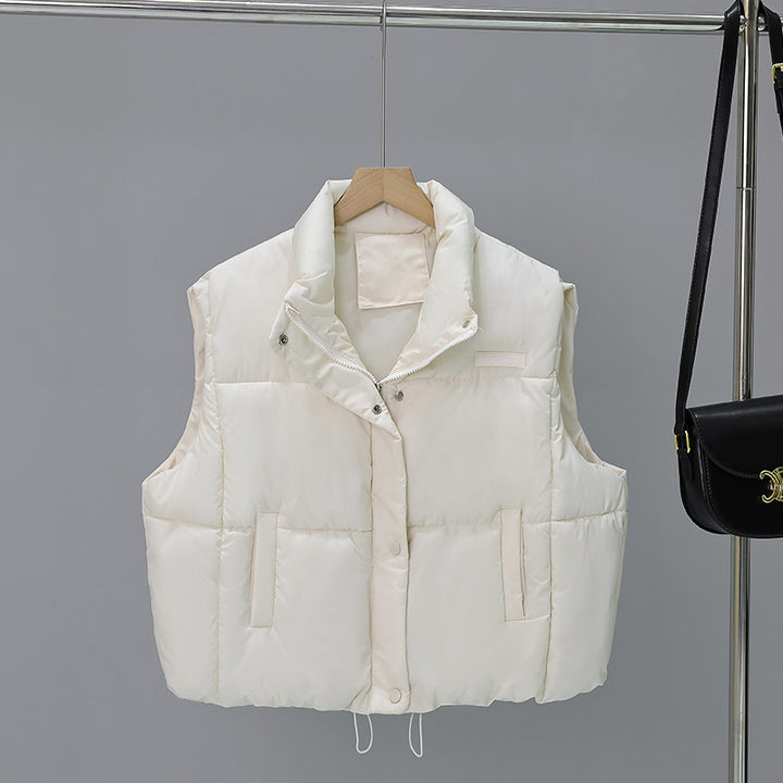 Women's short cut thermo quilted vest with high stand-up collar, snap button front and adjustable drawstring hem Mune Fashion