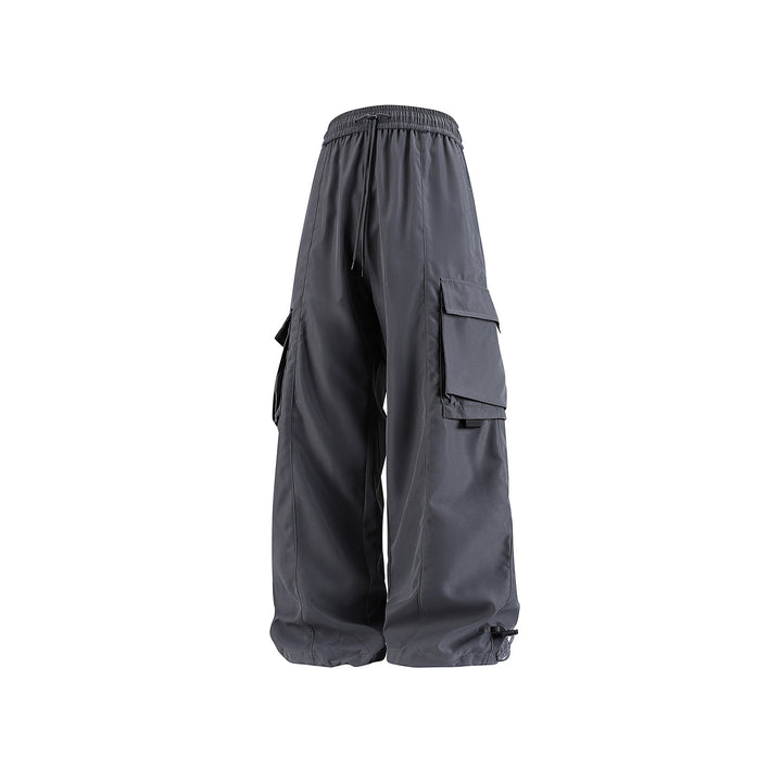 Men's wide utility cargo pants in baggy cut with drawstring waistband, large flap pockets, and adjustable leg hems Drune