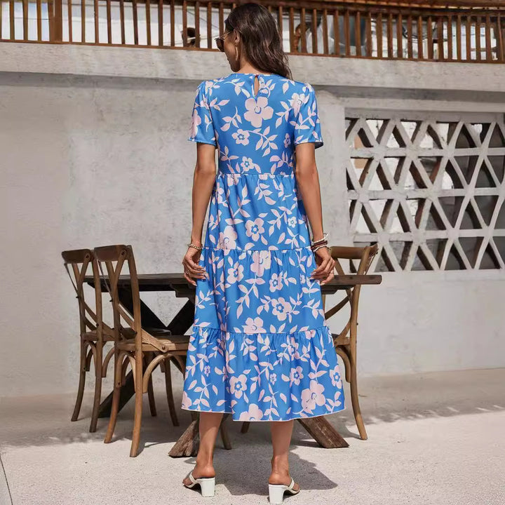 Ladies airy tiered midi dress with high waist seam, short sleeve and all-over floral pattern Mune Fashion