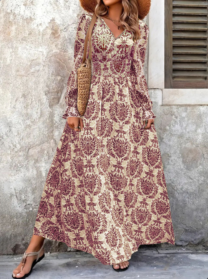 Ladies Flowing Maxi Dress with Gathered Smock Waist, Trumpet Sleeves, and Ornamental Print Mune Fashion