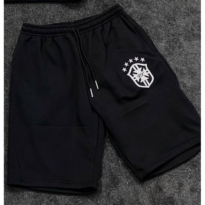 Women's loose jogging pants with elastic waistband, drawstring, and embroidered emblem Mune Fashion