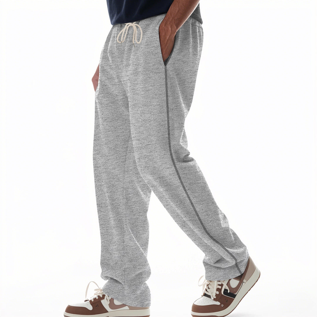 Men's casually fitting sweatpants with side decorative seam, elastic comfort waistband, and deep side pockets Mune Fashion