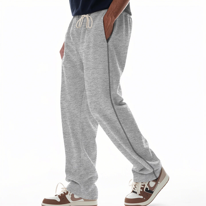 Men's casually fitting sweatpants with side decorative seam, elastic comfort waistband, and deep side pockets Mune Fashion