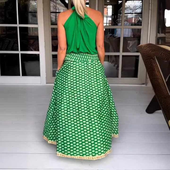 Women's two-piece halter neck set with gathered stand collar and patterned maxi skirt with elastic smocked waistband Mune Fashion