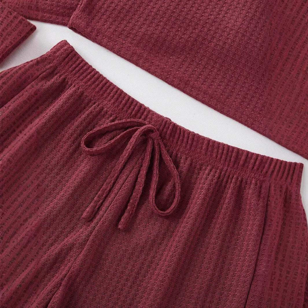 Ladies three-piece waffle knit lounge set with cropped pullover, spaghetti strap top and high-waisted shorts Mune Fashion